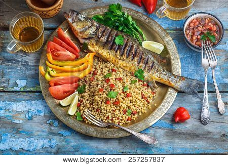 Grilled Sea Bass On Coper Plate, Moroccan Style