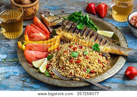 Grilled Sea Bass On Coper Plate, Moroccan Style