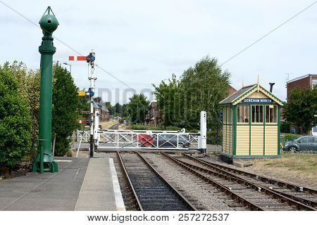 Dereham, Uk - August 4, 2018: Dereham Railway Station Showing Signal Box And Gate Style Level Crossi