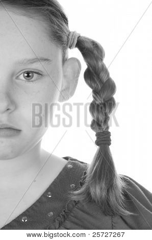 girl serious in braids