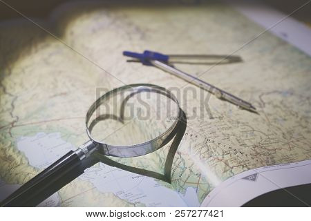 Magnifying Glass And Compass On Map For The Aventure