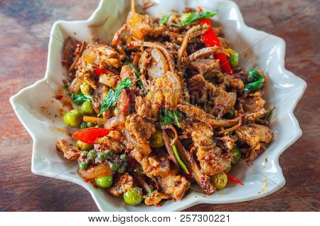 Fried Spicy Boar With Herb On Star Dish