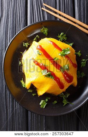 Japanese Cuisine: Omurice With Rice, Chicken And Vegetables Close-up. Vertical Top View