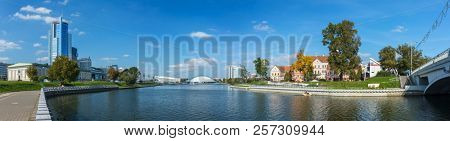 Minsk, Belarus - September 27, 2017: Panorama view of Svisloch riverwith Traetskae Pradmestse (Trinity Suburb) and new modern buildings in Minsk city center.