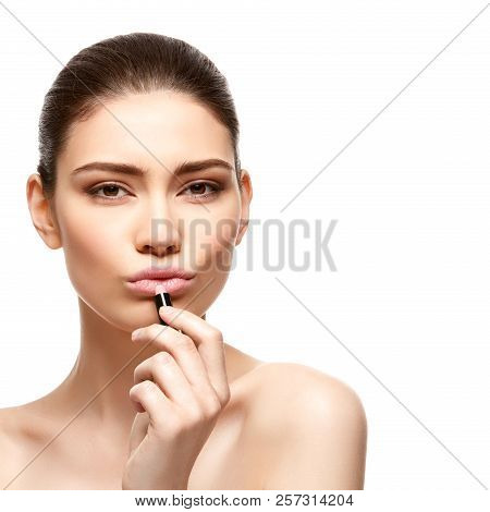 Girl Applying Pink Lipstick Isolated On White