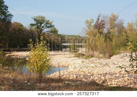 Bright Autumn Day On The Forest River. Kurdzhips River In The Krasnodar Region.