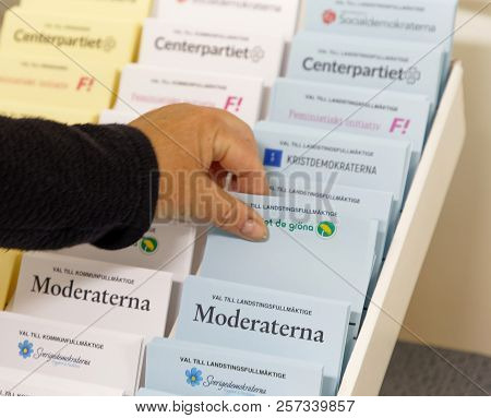 Stockholm, Sweden - Sep 09, 2018: Selectiing Ballot Papers Before Voting In The Polling-booth In The