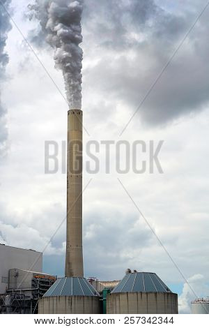 Smoke From The Pipe Of The Factory. Big Industrial Pipe With Smoke Going Outside. Toxic Smoke Pollut