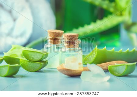 Aloe Vera Extract In A Small Bottle And Pieces On The Table. Selective Focus.