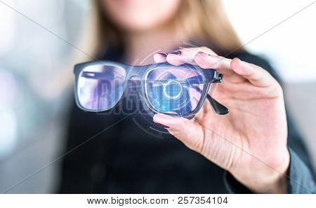 Virtual Screen Smart Glasses With Futuristic High Tech Interface. Woman Holding Spectacles With Nano