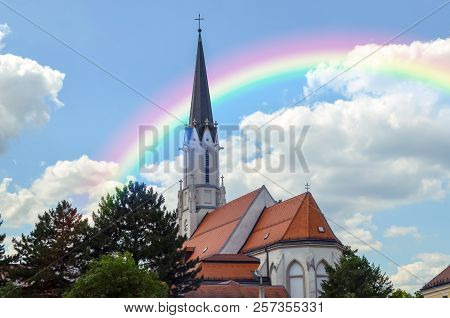 Vienna, Austria - June 19, 2018: Beautiful Rainbow Over Catholic Parish Church Maria Hietzing