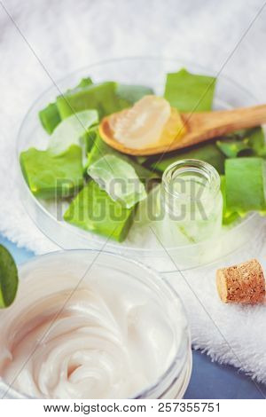 Aloe Vera Extract In A Small Bottle And Pieces On The Table. Selective Focus.