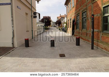 Retractable Bollard System In The City Gustrow.
The Bollard Hinders Vehicles When Entering The City.