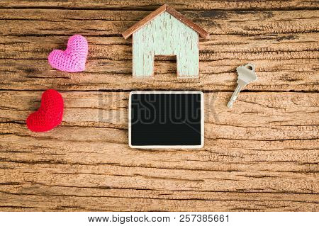 A Wooden Home And Red Heart For Family And Blackboard For Ad Text And House Key Put On The Wood, Loa