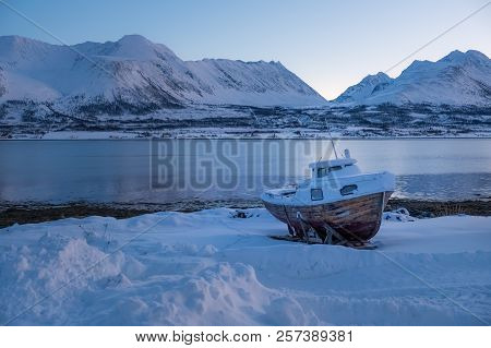 Landscape Of Norway In Winter During Blue Hour. Norwegian Coastline In Winter. Mountain Covered With
