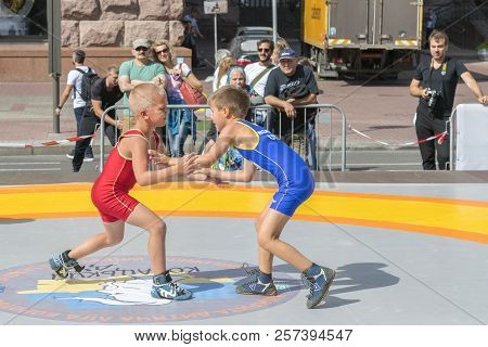 Ukraine, Kiev, Ukraine 09.09.2018 Boys On Street Tatami Engaged In Greek Wrestling.