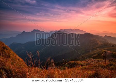 Sunset Scene With The Peak Of Mountain And Cloudscape At Phu Chi Fa In Chiang Rai,thailand