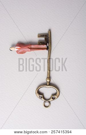 Tiny Figurine Of Man Miniature And Retro Key