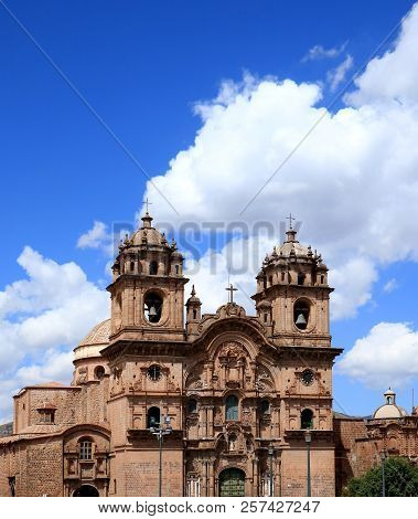 The Iglesia De La Compania De Jesus Church Against Sunny Vivid Blue Sky Of Cusco, Peru, South Americ