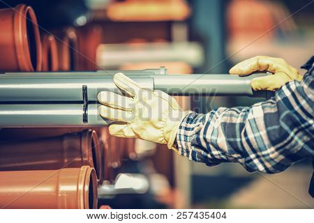 Construction Plastic Pipes In The Building Supplies Shop. Choosing Right Materials For Sanitary Syst