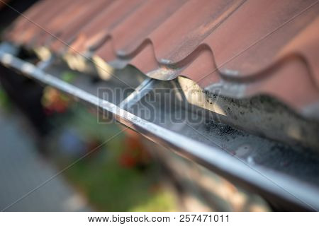 Gutter Draining Rainwater. The Building Is Equipped With Drainage Of Rainwater From The Roof.