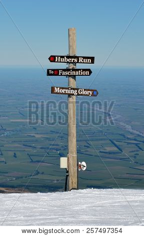 Mount Hutt Ski Runs Sign, Canterbury, New Zealand. In The Back Ground Are The Canterbury Plains.