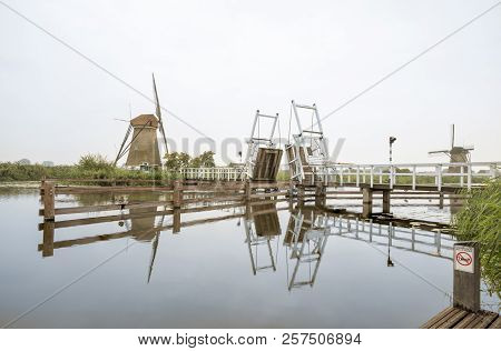 In Kinderdijk In The Netherlands This Beautiful Drawbridge Is Attached To The Windmill