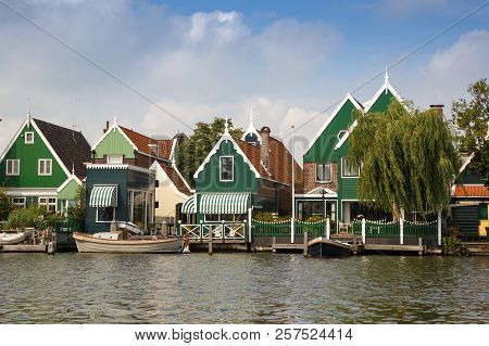Traditional, Authentic Dutch Houses And Boat At The Canal.