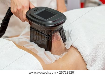 Woman Getting Cryolipolysis Fat Treatment Procedure In Professional Cosmetic Cabinet Or Spa Center