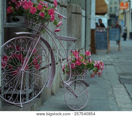 City Design: Flower Basket In The Form Of Antic Bicycle.
