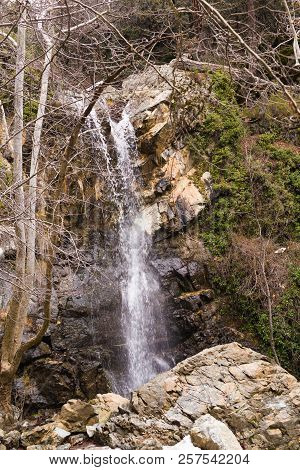 Autumn Waterfall With Rocks And Leaves In Troodos Mountains In Cyprus