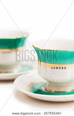 Set Of Dishes On White Background. Green Indian Cups