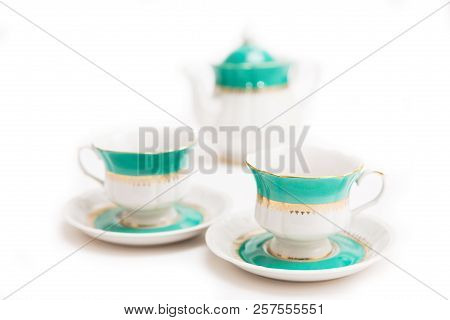 Set Of Dishes On White Background. Green Indian Cups And Kettle