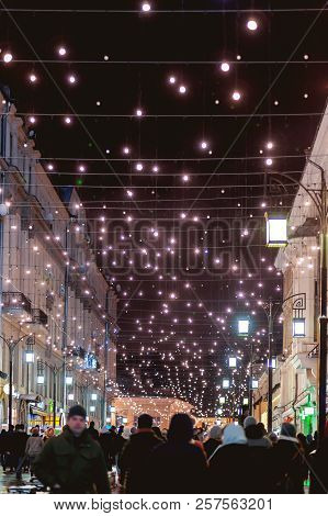 Moscow, Russia - Decembar 24, 2017. People Walking On Streets Of Moscow, Decorated To Celebrate The 
