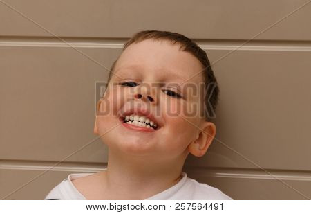 Boy, Child, In A White T-shirt Opened His Mouth On Examination With A Doctor. A Dentist Or An Otolar