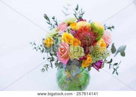 Colorful Bouquet Of Yellow, Coral And Rose Roses, Blue Eringium, Red Leucospermum, Orange Asclepia, 