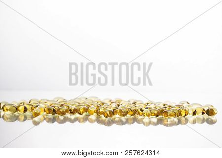 Fish Oil Supplement Capsules Isolated On White Background