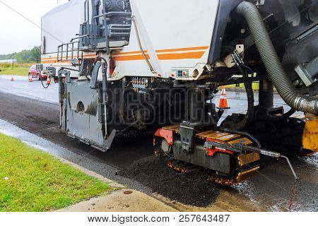 The Special Car With A Hydrohammer Removes An Old Paving From Asphalt In The Road In A Construction 