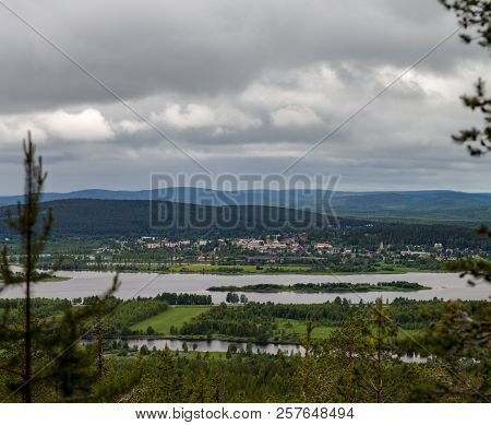 Finland, Views From The Top Of Aavasaksa Mountain With Houses, Forest And Mountains And The River On
