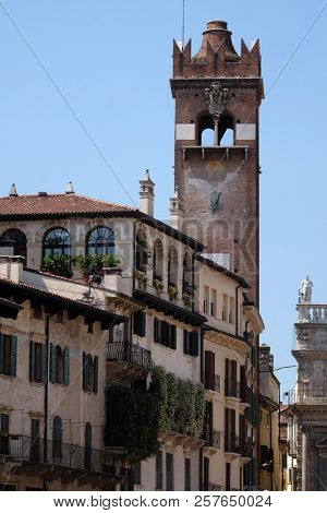 VERONA, ITALY - MAY 27: Tower Torre del Gardello near Palazzo Maffei on Piazza delle Erbe square in Verona, Italy, on May 27, 2017.