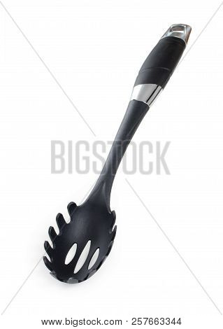 Black Plastic Spoon For Draining Of Spaghetti Isolated On White Background