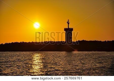 A Lighthouse In Silhouette, Galapagos Islands, Ecuador