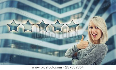 Сheerful Girl Smiling Show Thumb Up Like Gesture Choosing Five Stars Rating. Excellent Customer Serv