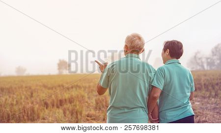 Asian Elderly Couple At Farm Rice Field Business Happy Nature Lifestyle