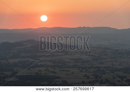 Sunset At The Morvan In France With Hills And Small Villages.