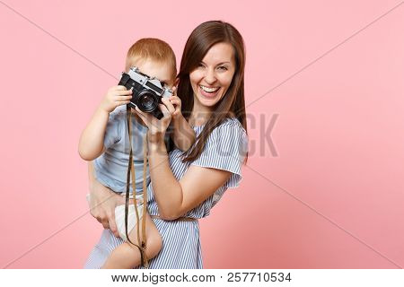 Portrait Of Happy Family. Mother Keep In Arms, Have Fun, Hug Son Baby Boy, Take Picture On Retro Vin
