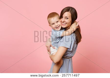 Portrait Happy Young Family. Mother Keep In Arms, Tender Embrace, Gently Hugs Child Kid Son Baby Boy