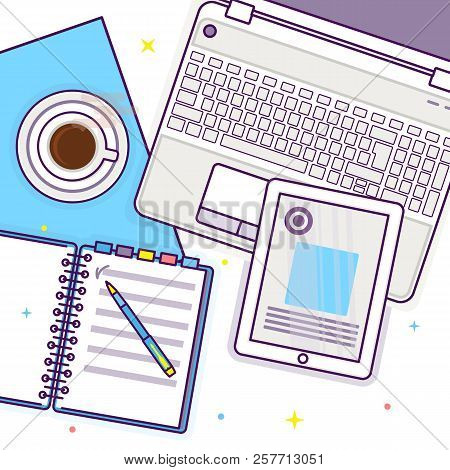Flat Lay With Tablet, Laptop, Open Book, Notepad And Cup Of Coffee