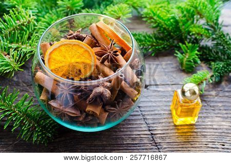 Christmas Fragrance Concept. Christmas Spices Still Life With Cinnamon Sticks, Star Anise And Dried 