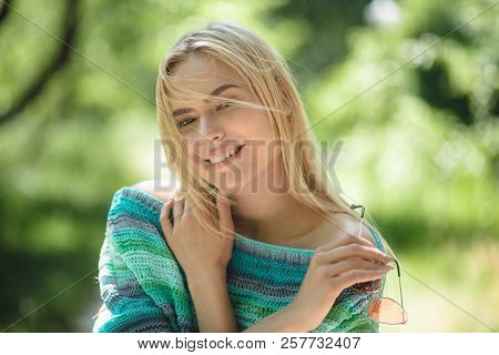 Happy Cheeerful Girl Hugging Herself. Portrait Of Glowing Smiling Lady With Light Blonde Hair Outsid
